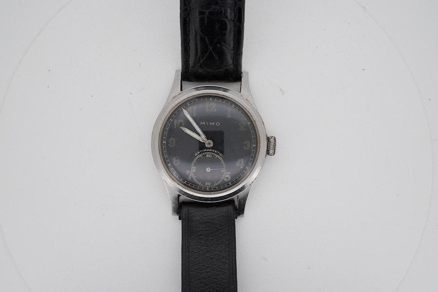 A gentleman's mid 20th century steel Mimo manual wind wrist watch, with black Arabic dial and subsidiary seconds, case diameter 35mm, on a later associated leather strap.